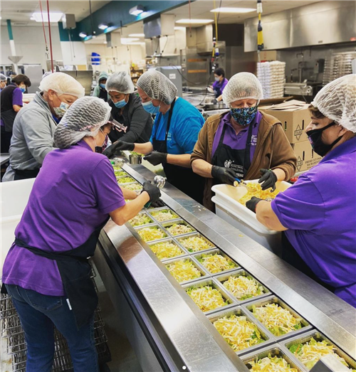 Nutrition Services workers prepare school meals